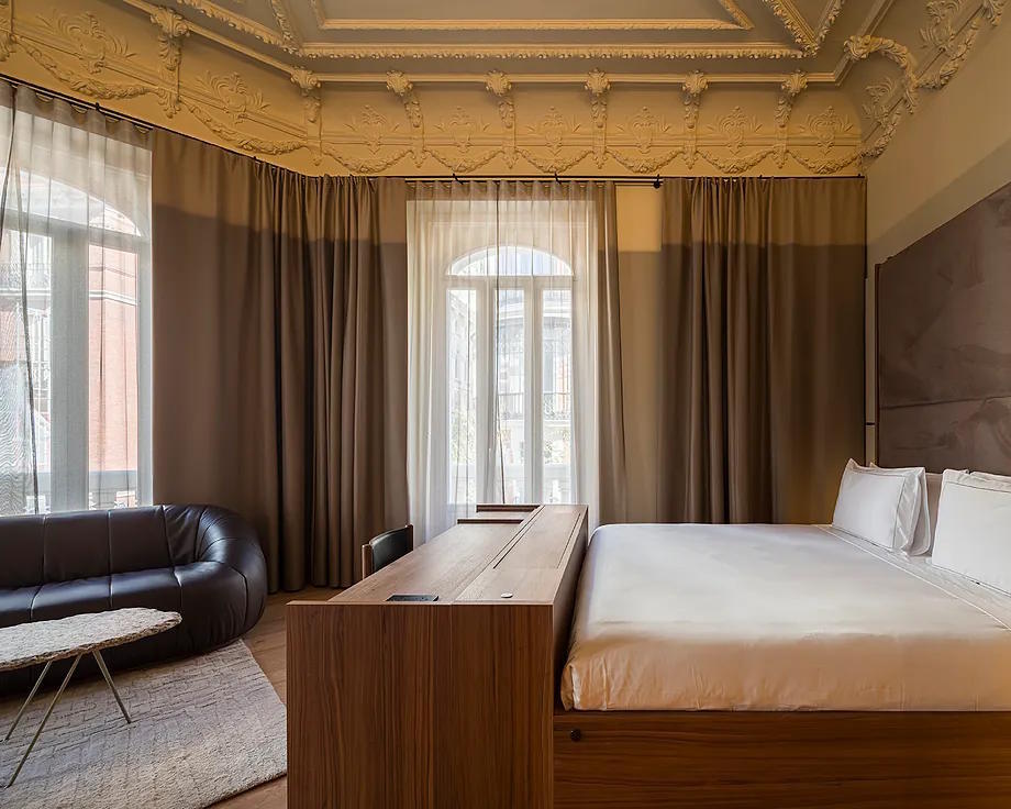 High ceilings, old moldings, designer beds and furniture in the 61 rooms.