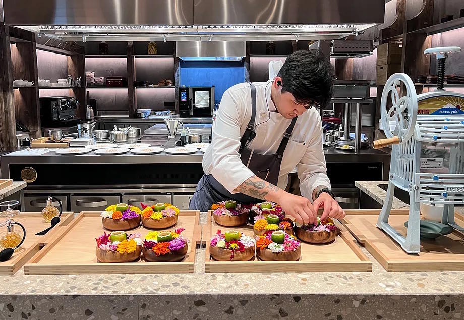 The open kitchen of the restaurant for 24 diners.