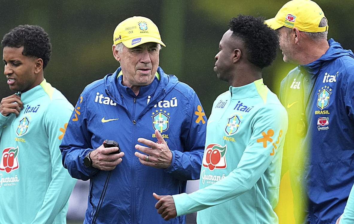Brazil's coach Carlo Ancelotti, second from left, talks with his player Vinicius Junior, second from right.