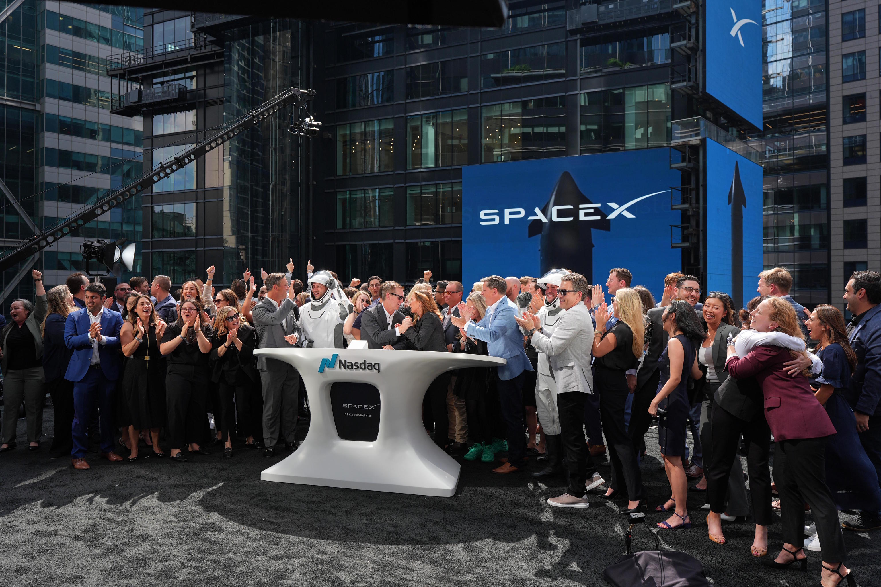 SpaceX employees celebrate during a closing bell ceremony for the IPO of SpaceX at the Nasdaq MarketSite in New York.