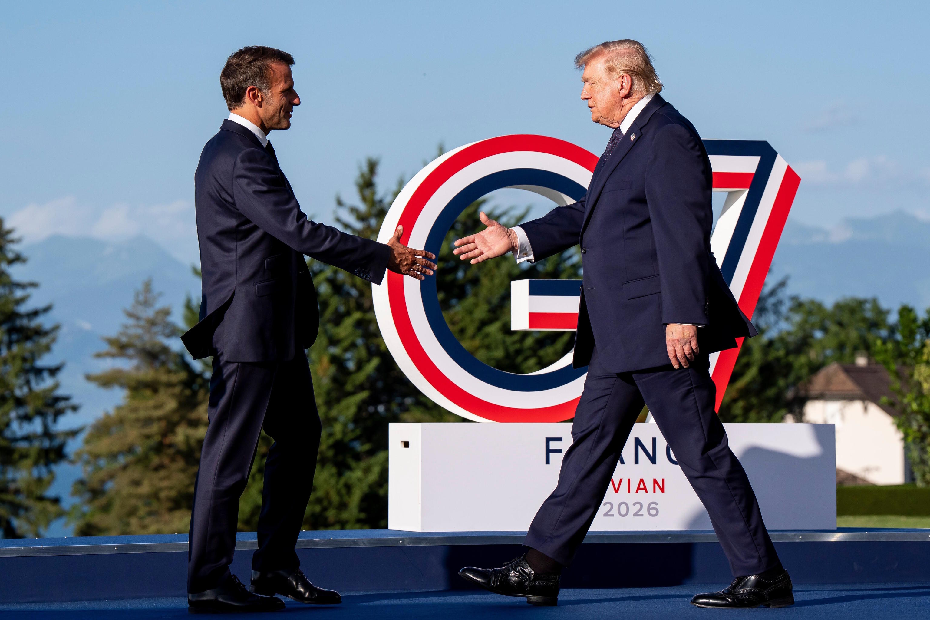 Trump shakes hands with Macron during a bilateral meeting in Evian.