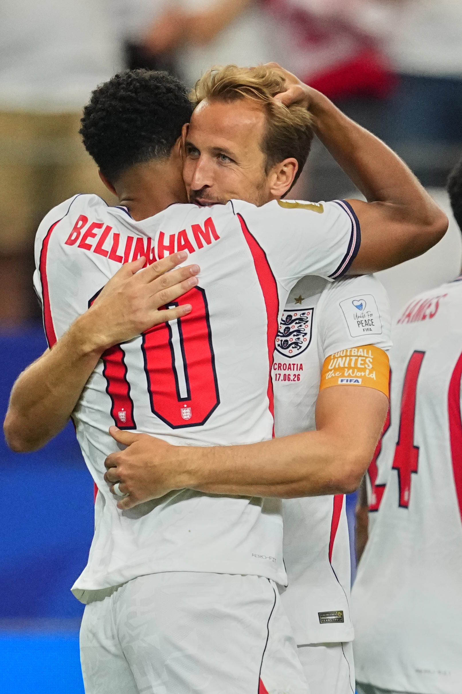 England's Jude Bellingham embraces Harry Kane.