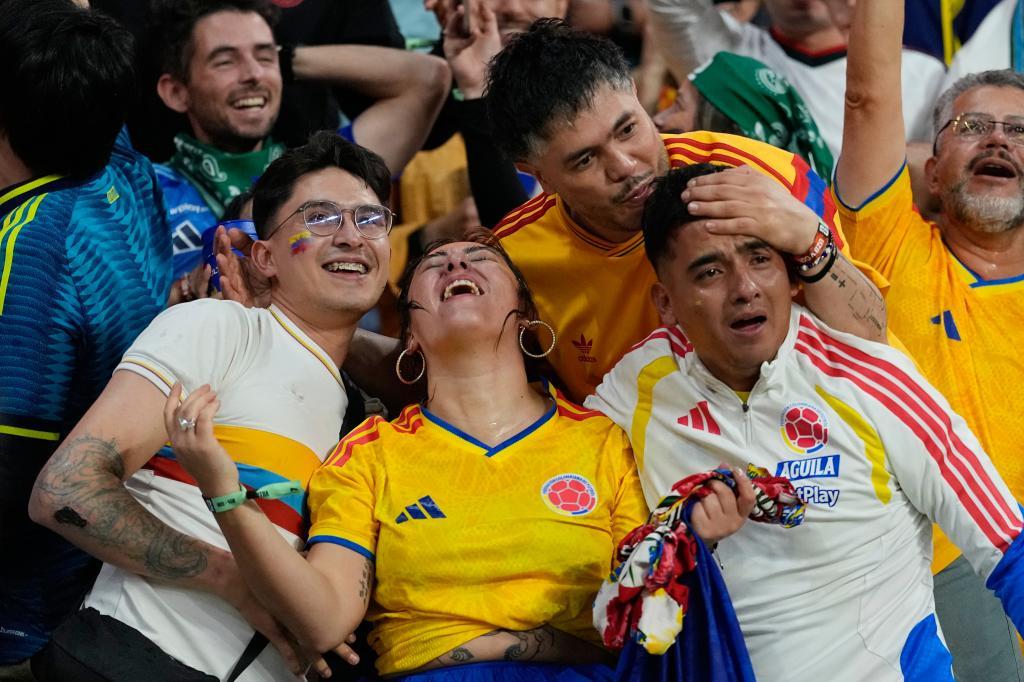 Colombian fans react during the World Cup.