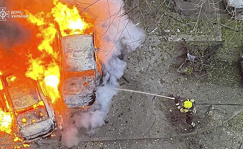 The Ukrainian Emergency Service, emergency services personnel work to extinguish a fire following a Russian rocket attack in Poltava