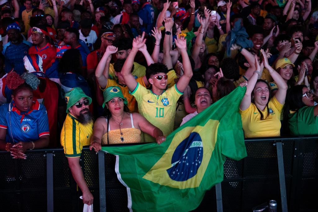 Fans celebrate after Brazil won over Haiti.