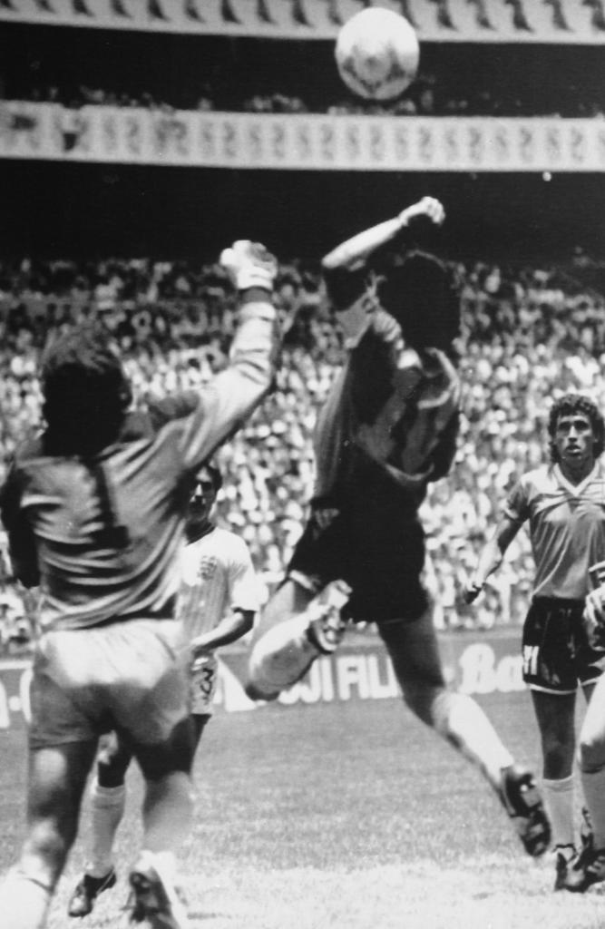 Argentine midfielder Diego Maradona about to score the controversial first goal against England