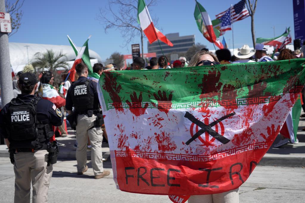 Anti-Iranian regime demonstrators protest outside of the World Cup Group G soccer match between Belgium and Iran