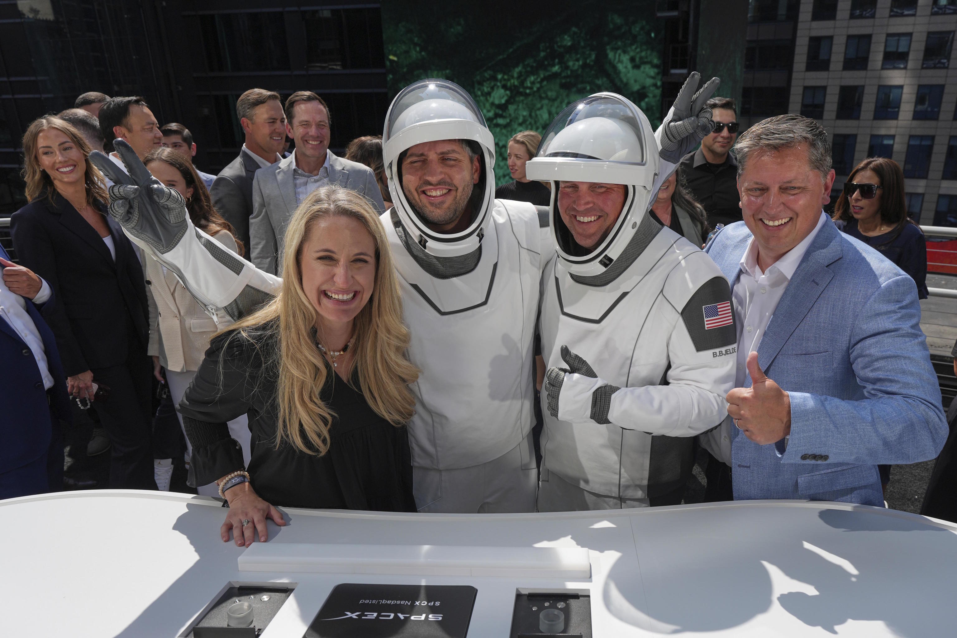 SpaceX employees applaud during the company's IPO on June 12.