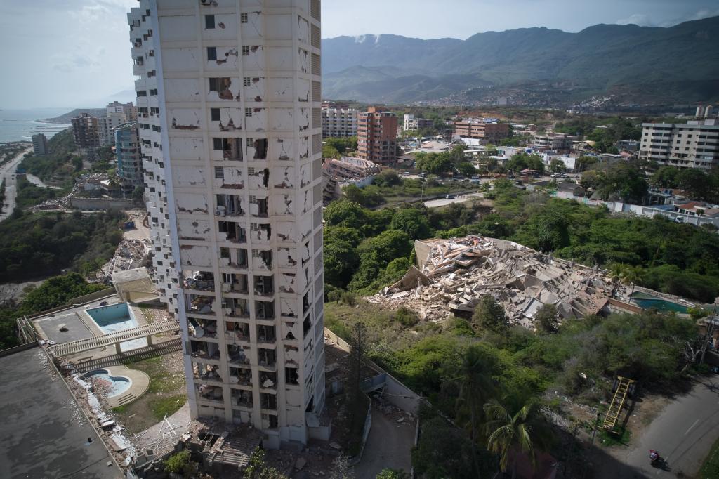 Damaged buildings remain standing a day after earthquakes struck La Guaira, Venezuela