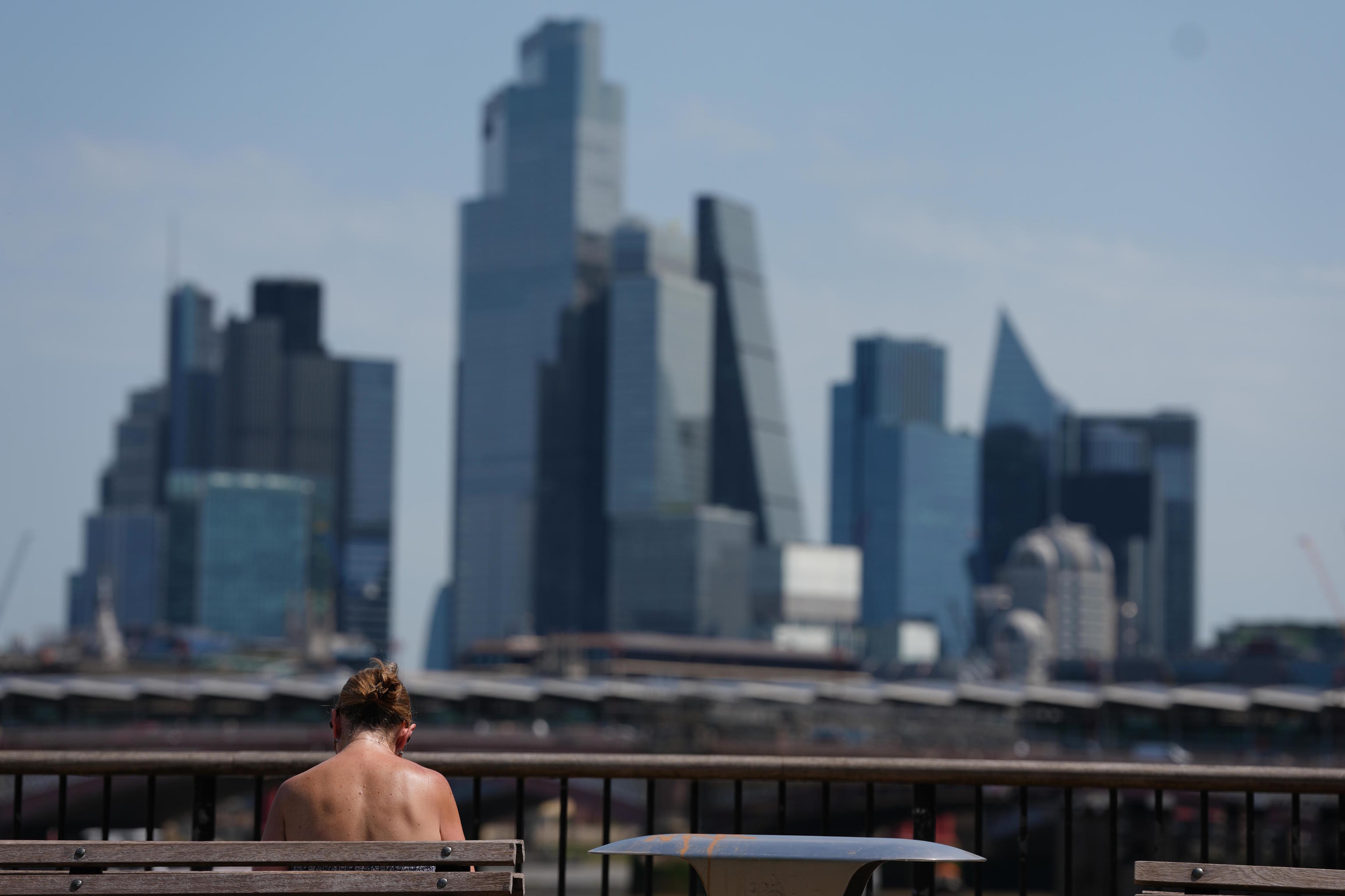 A woman sunbathes in London.