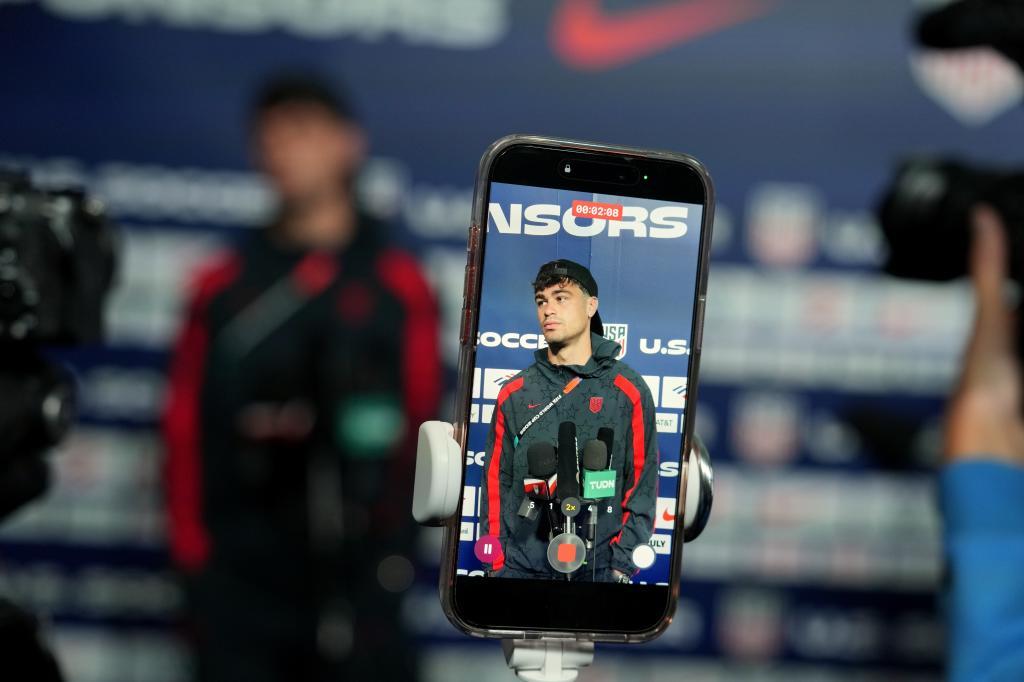 United States' Giovanni Reyna is seen on a cellphone screen