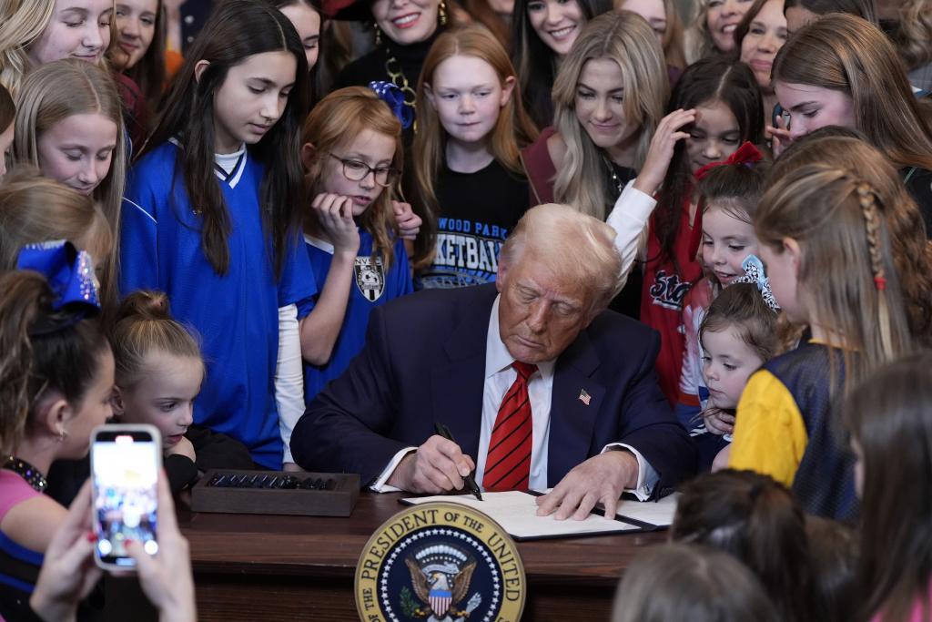 President Donald Trump signs an executive order barring transgender female athletes from competing in women's or girls' sporting events