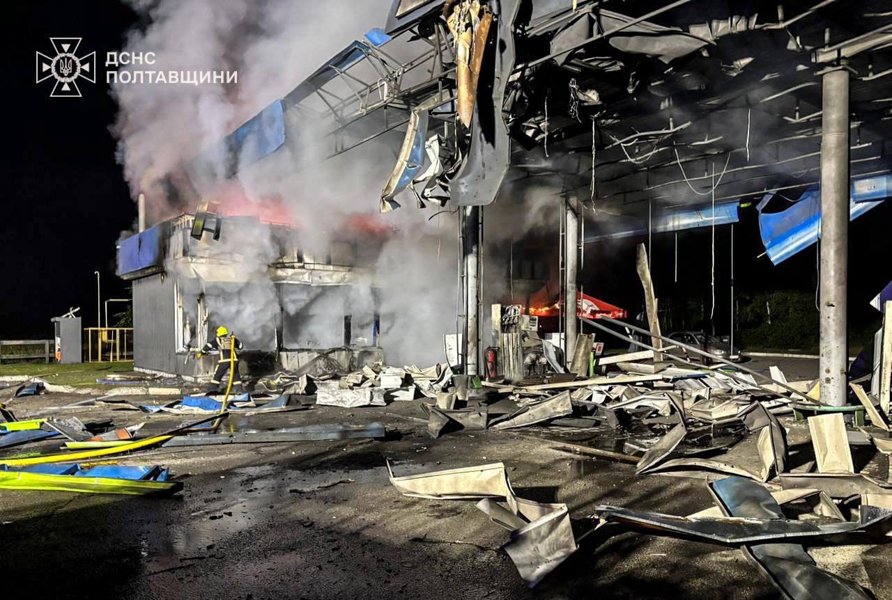 A rescue worker puts out a fire of petrol station damaged by a Russian strike on Poltava region.