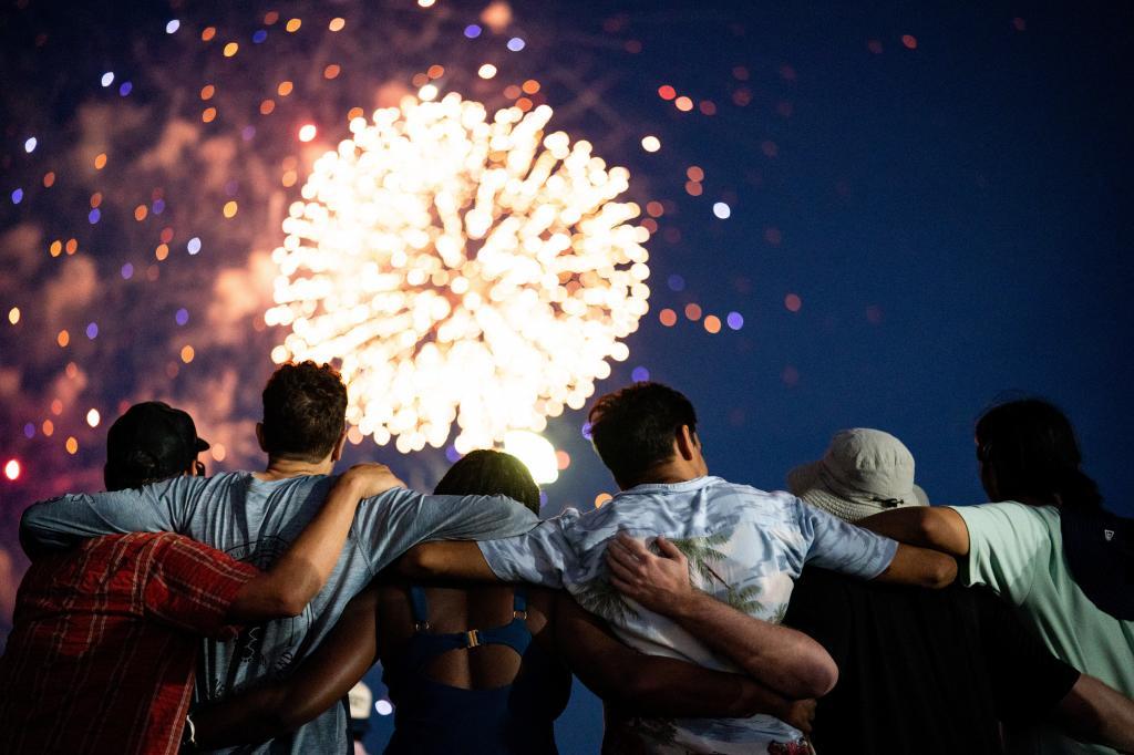 People watch Canada Day fireworks at Woodbine Beach