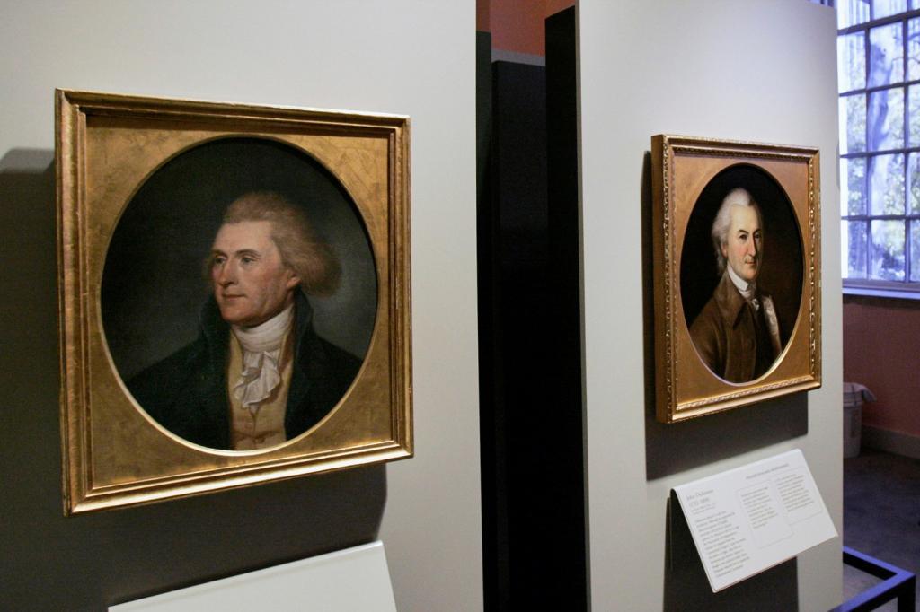 Portraits of a red-headed Thomas Jefferson, left, and John Dickinson, right