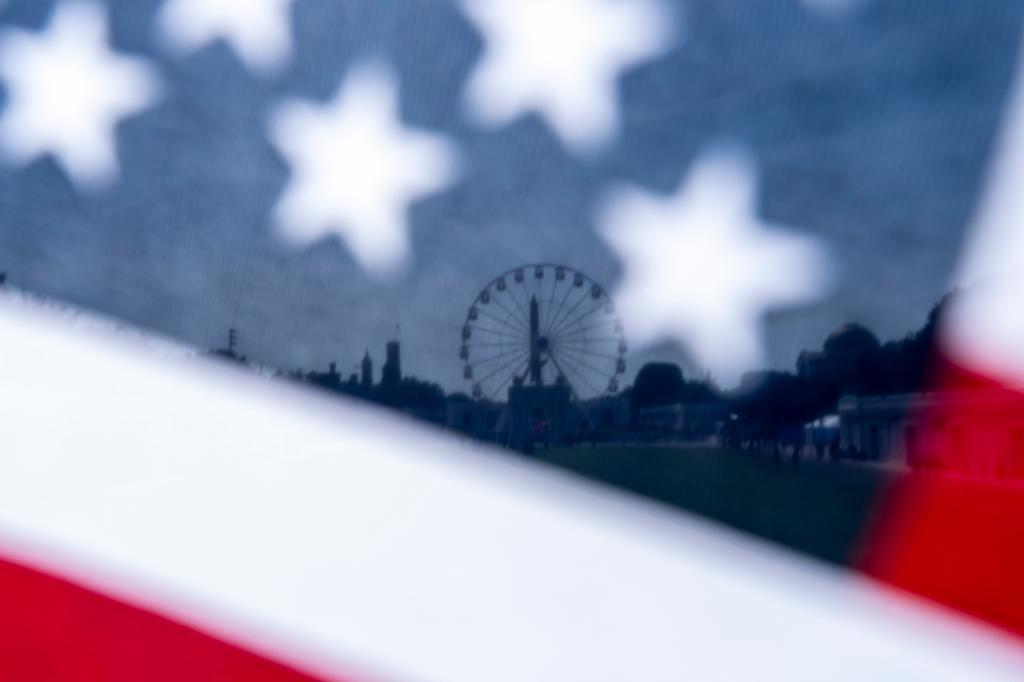 The Great American State Fair on the National Mall is seen through an American flag
