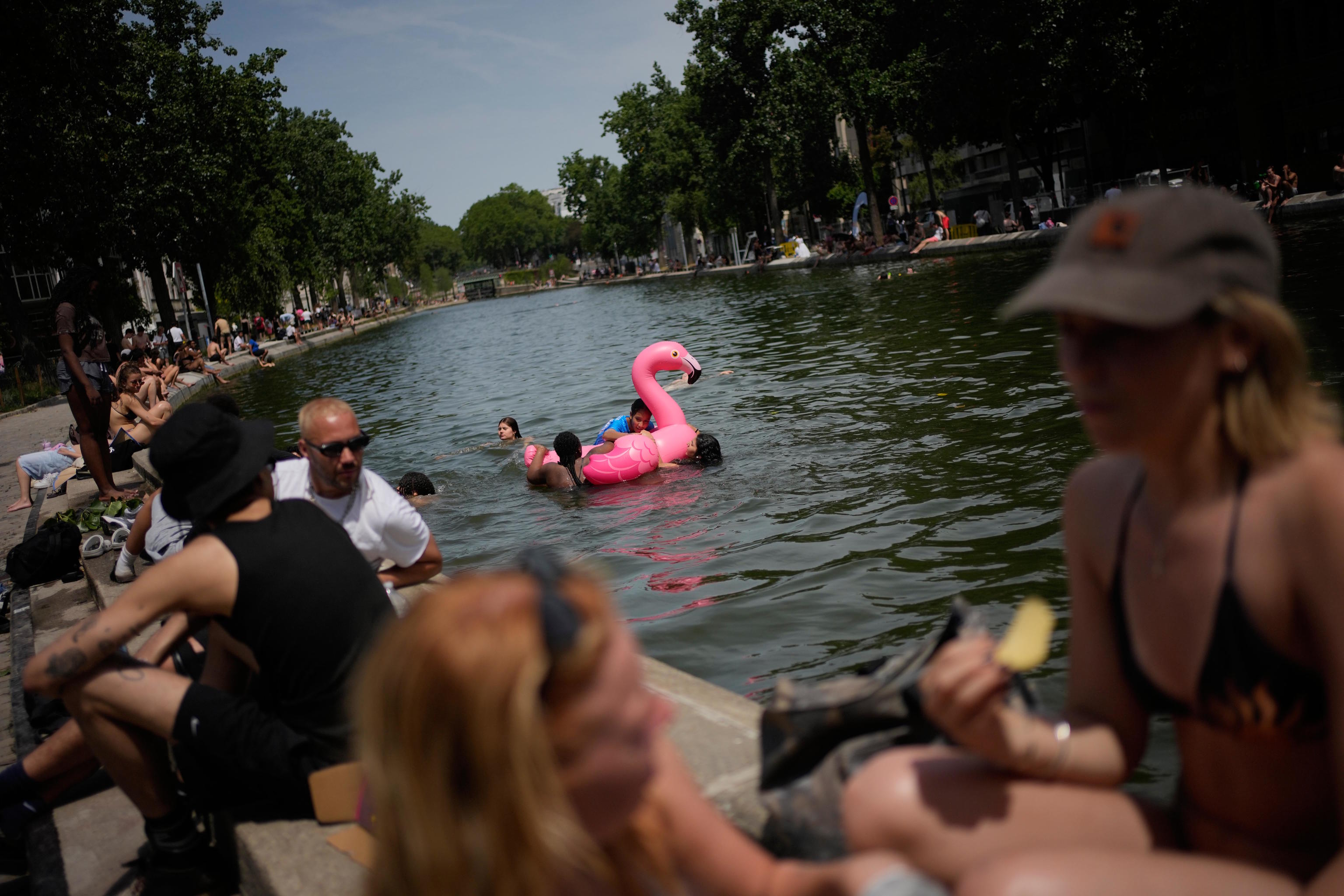 Parisians bathe in the Canal Saint-Martin in Paris.