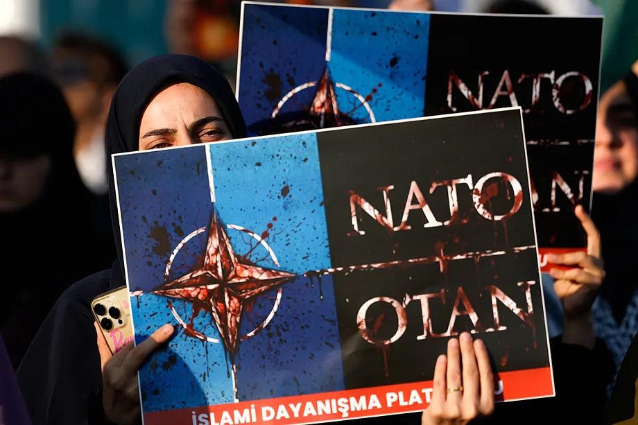 Protesters hold banners in Istanbul on Saturday against the upcoming NATO summit in Ankara.