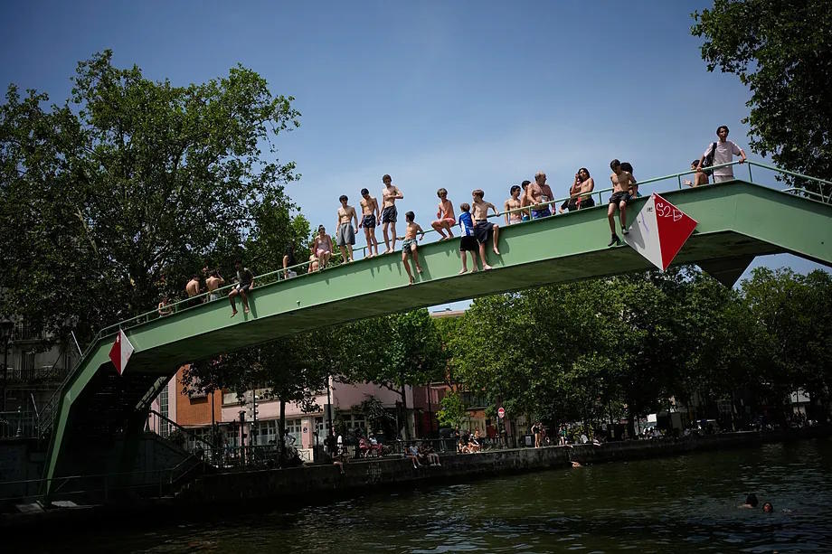 Parisians bathe in the Canal Saint-Martin in Paris during the heatwave.