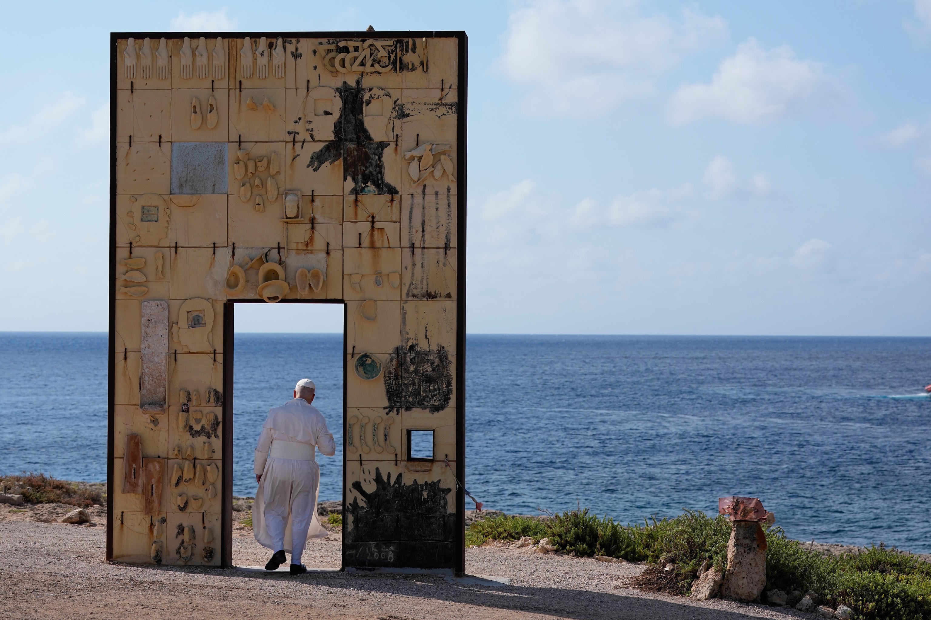 Pope Leo XIV visits the Gate of Europe monument in Lampedusa, Sicily.