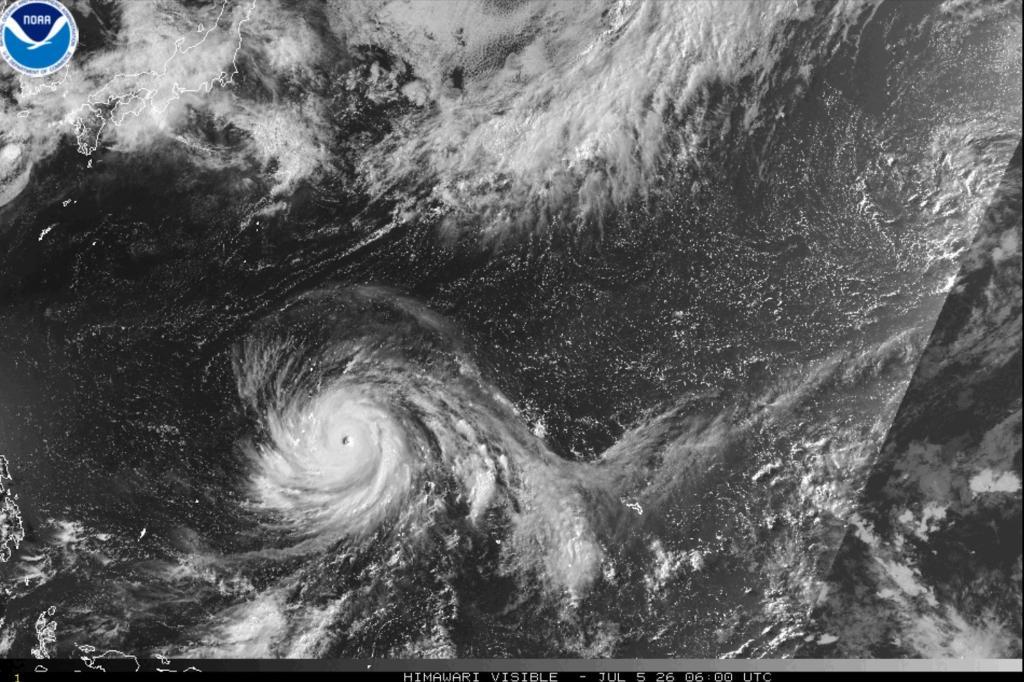 This satellite image released by NOAA shows Typhoon Bavi developing in the western Pacific