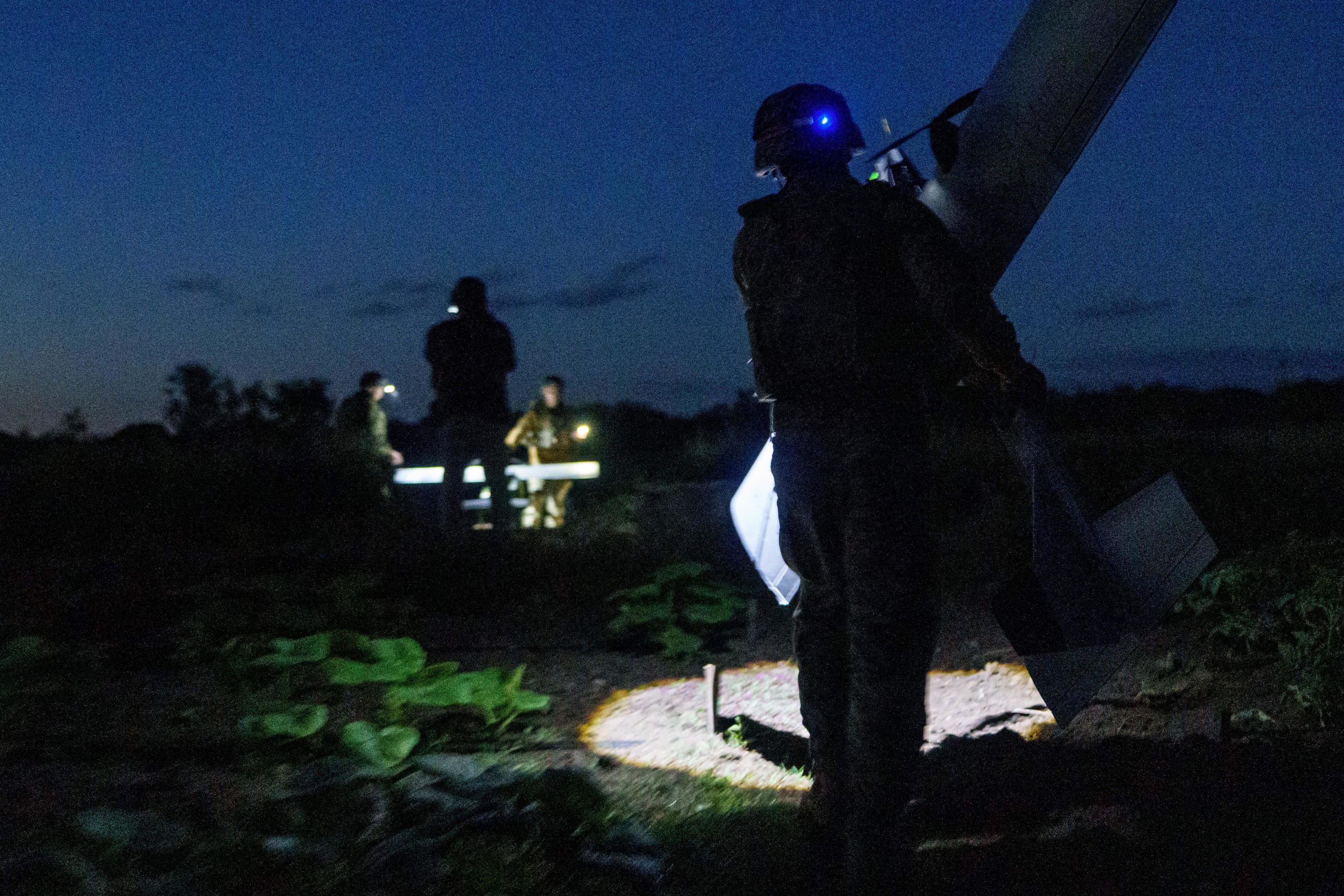 Ukrainian servicemen of K-2 brigade of the Unmanned Systems Forces carries a midrange drone.