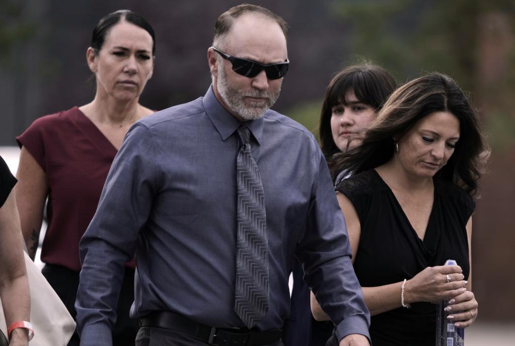 Matt Robinson, father and Amber Robinson, mother, right, of Tyler Robinson arrive at the Fourth District Courthouse