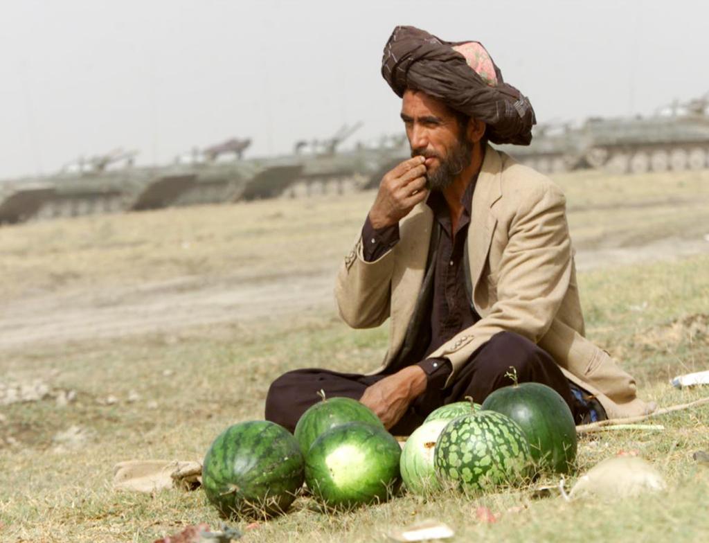 An Afghan man is selling watermelons.