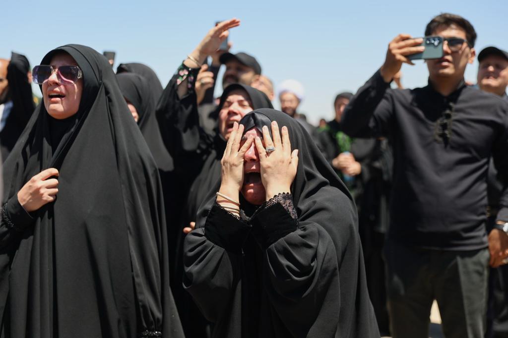 Women react as the coffin of the late Iranian Supreme Leader Ayatollah Ali Khamenei