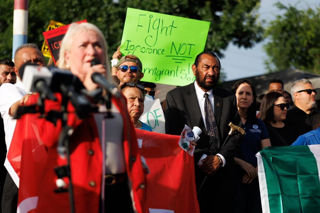 Congressman Al Green, right, listens as Congresswoman Sylvia Garcia
