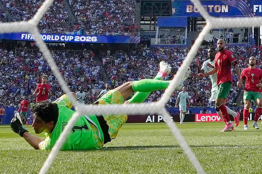 Bono's futile stretch in Demb�l�'s goal.