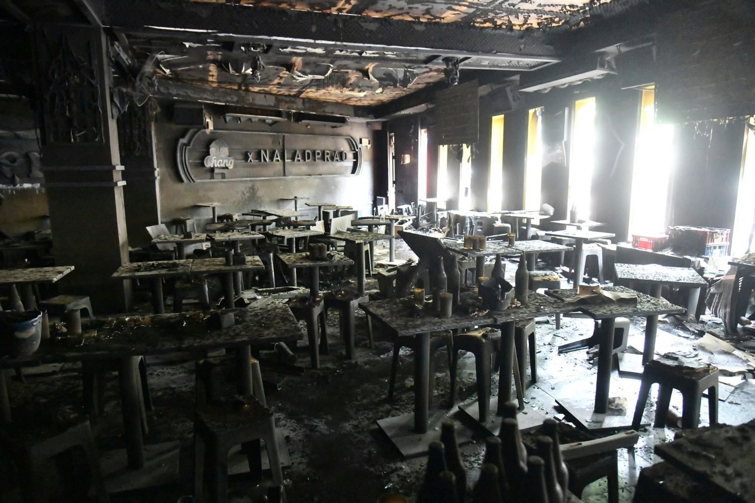 The interior of a beer bar is seen after a fire in Bangkok.