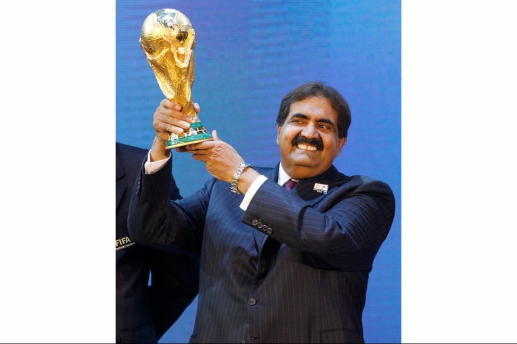 Sheikh Hamad bin Khalifa Al Thani, Emir of Qatar, holds the World Cup trophy