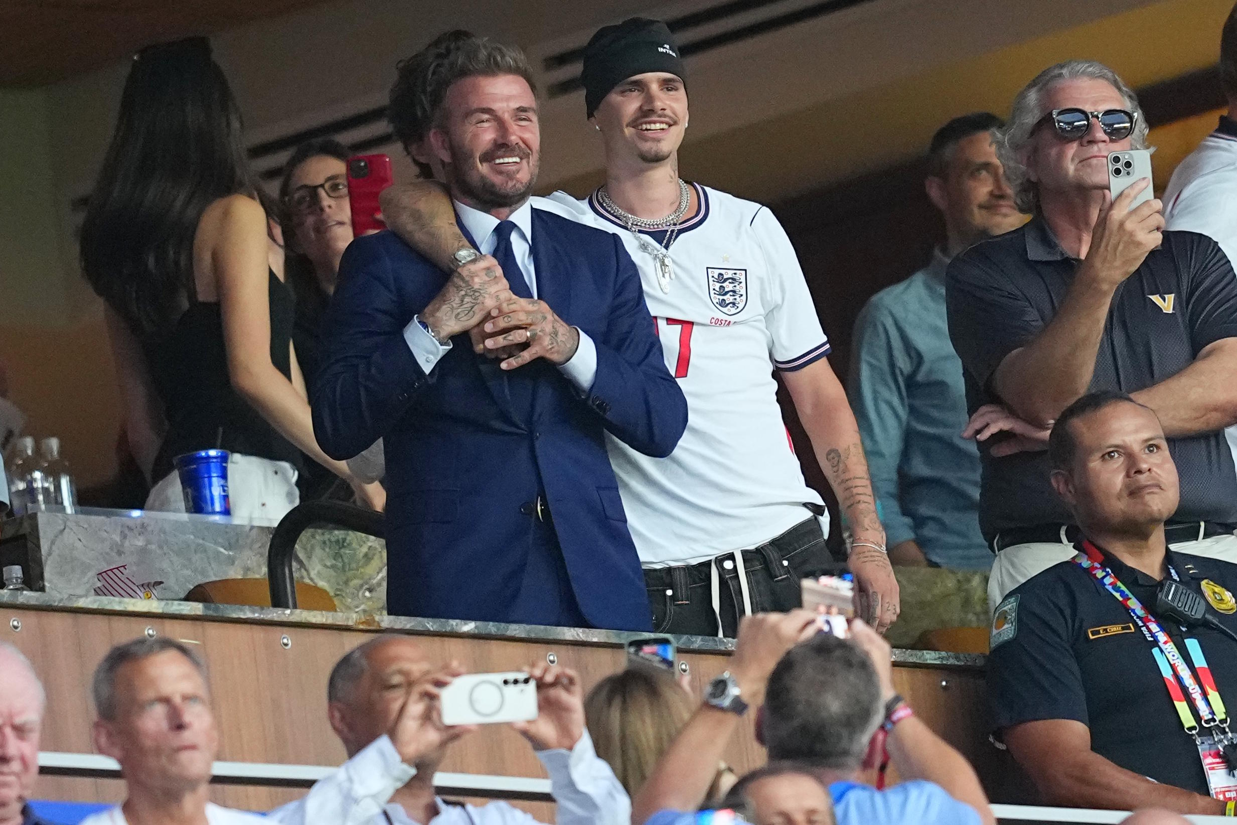 Beckham as his son Romeo celebrate after the World Cup quarterfinal soccer match.