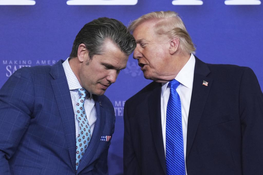 President Donald Trump speaks with Defense Secretary Pete Hegseth