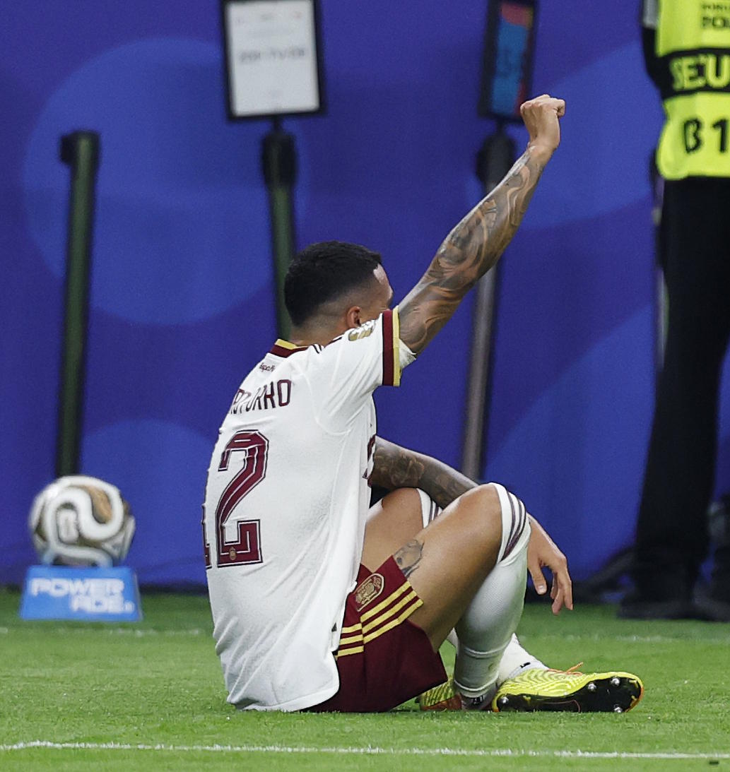 Porro celebrates Spain's second goal.