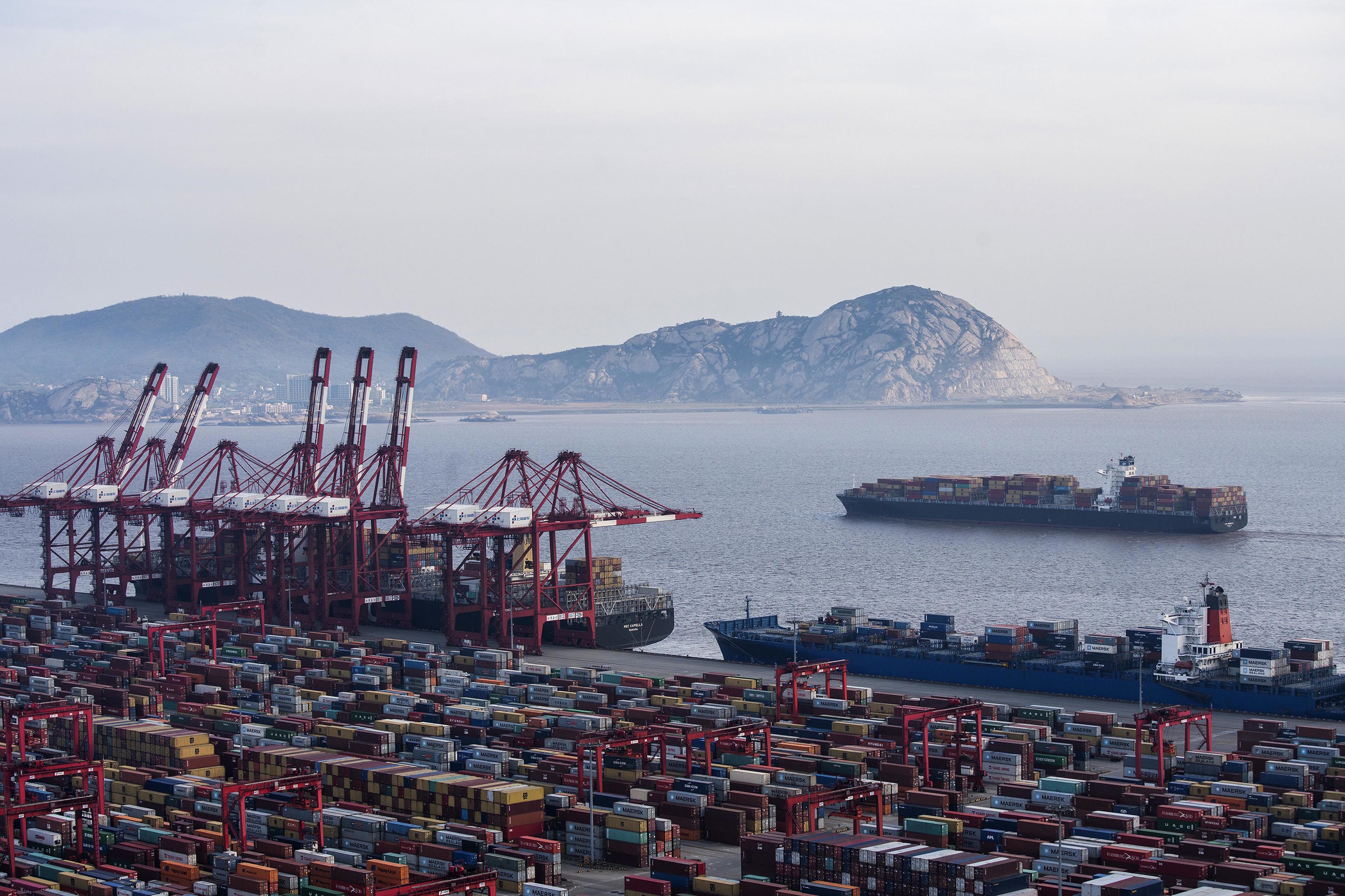 Container ships is docked at the Yangshan port in Shanghai.