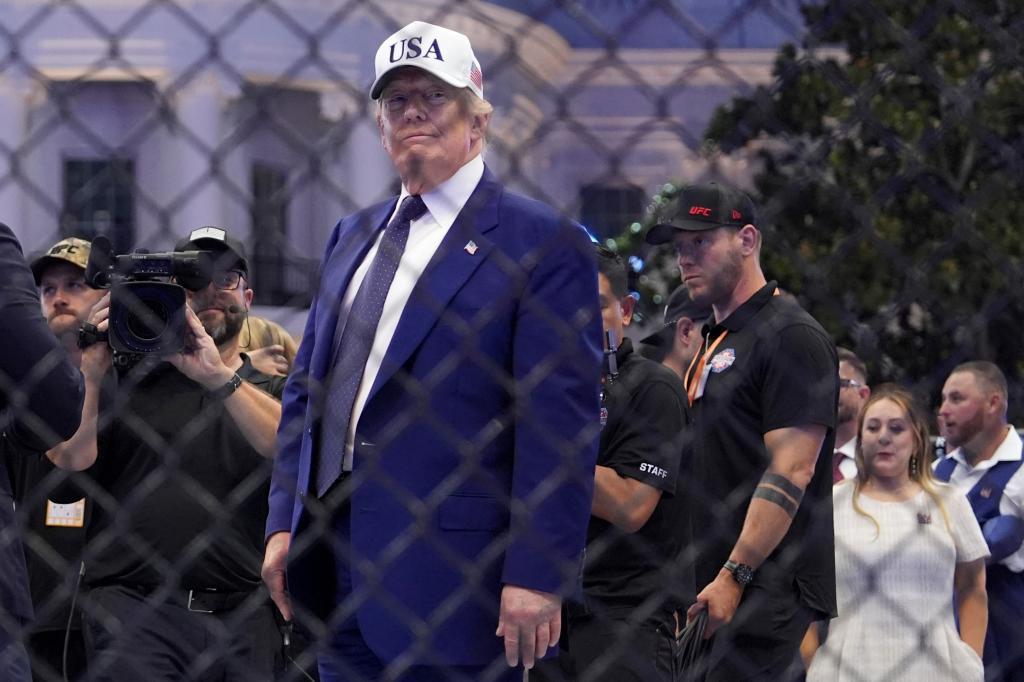 President Donald Trump stands in the ring after Justin Gaethje defeated Ilia Topuria