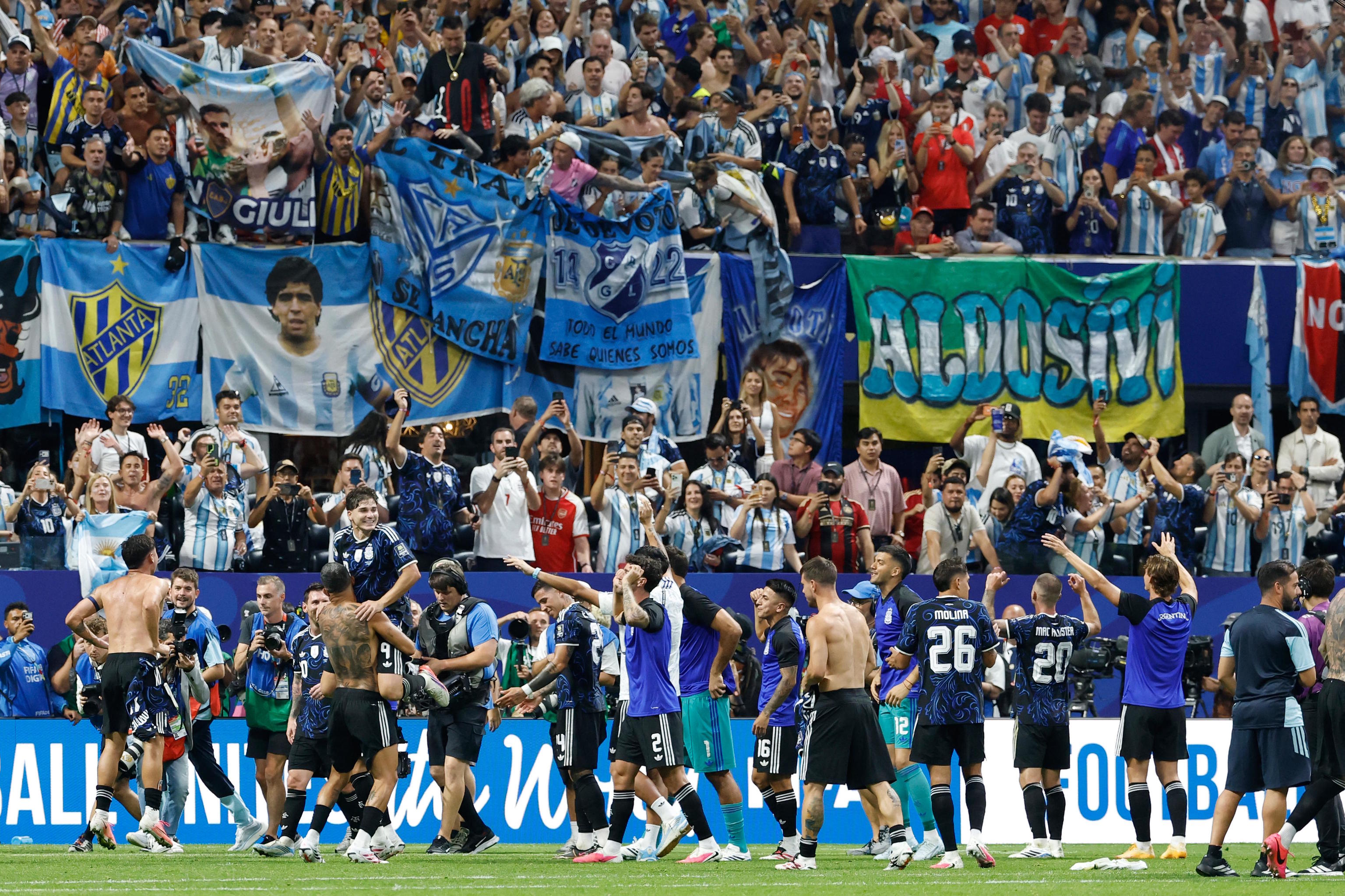 Argentina players celebrate after the World Cup semifinal soccer match.