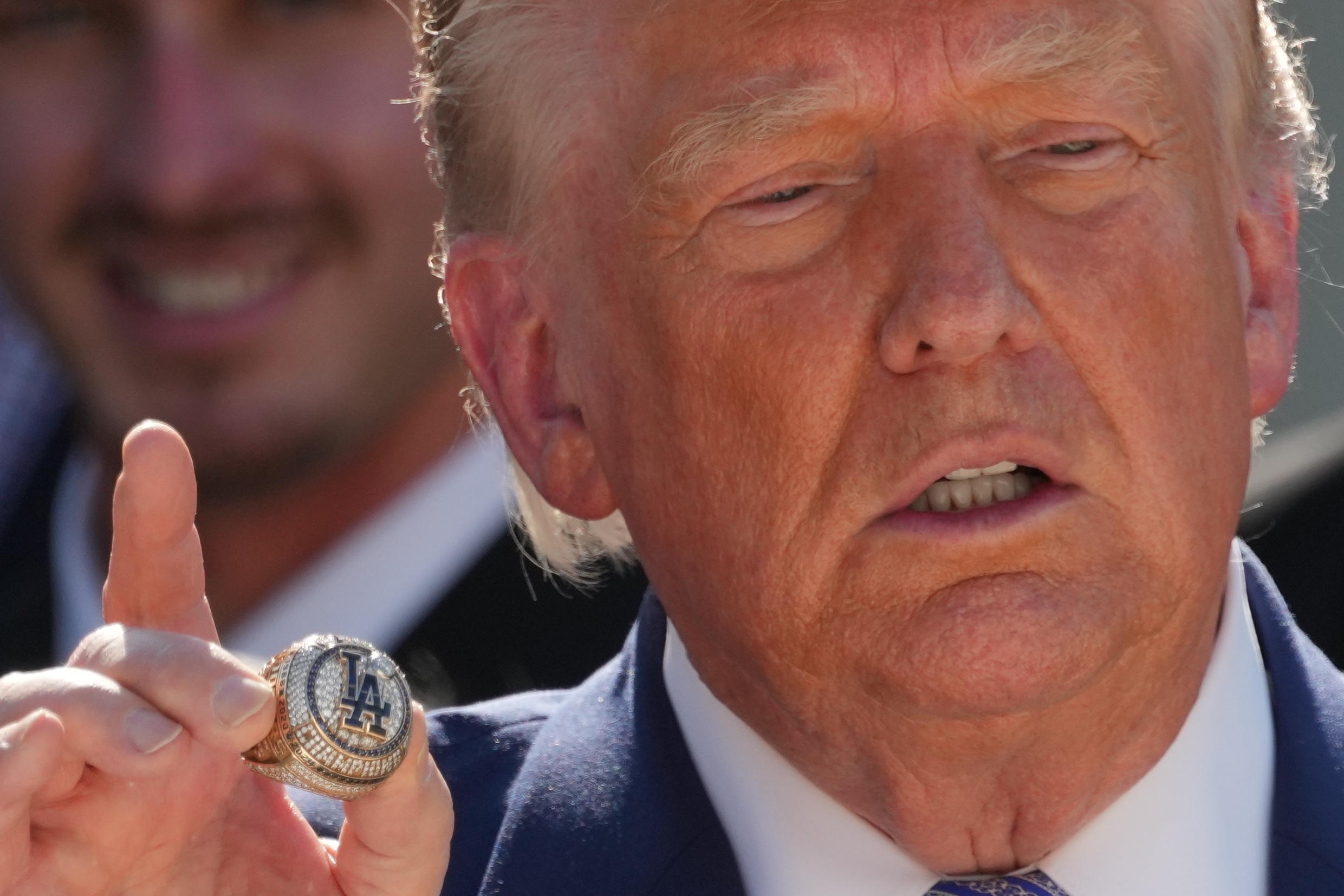 President Donald Trump holds a championship ring.