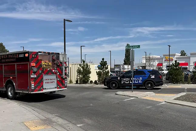 Firefighters and police outside the scene of the shooting.