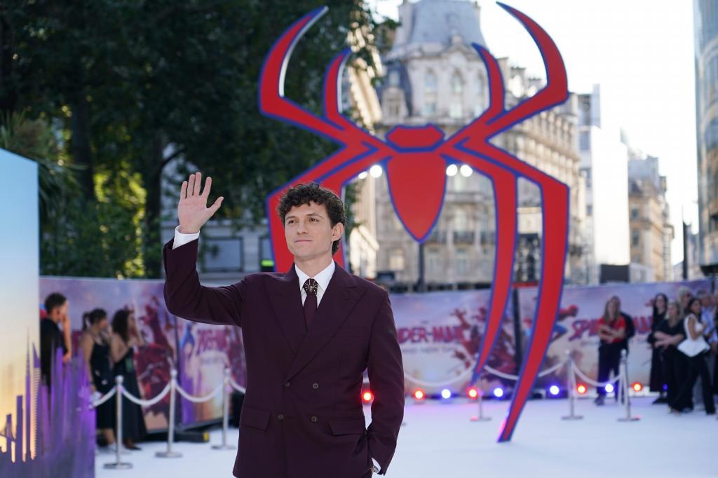 Tom Holland poses for photographers upon his arrival at the premiere of "Spider-Man"