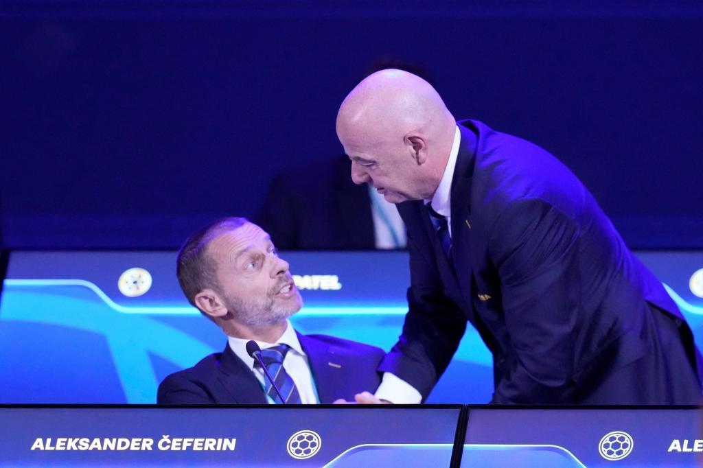 FIFA President Gianni Infantino (right) talks with UEFA President Aleksander Ceferin,
