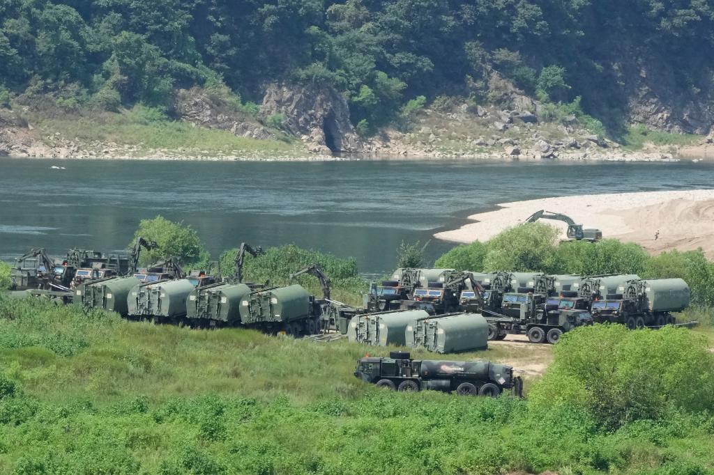 The U.S. Army's armored vehicles gather to cross a river at a training field in Yeoncheon