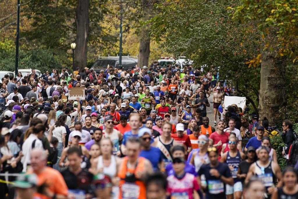 Runners participate during the New York City Marathon along Central Park in the Manhattan