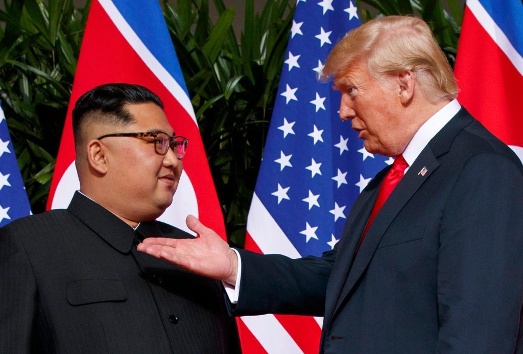 U.S. President Donald Trump, right, meets with North Korean leader Kim Jong Un