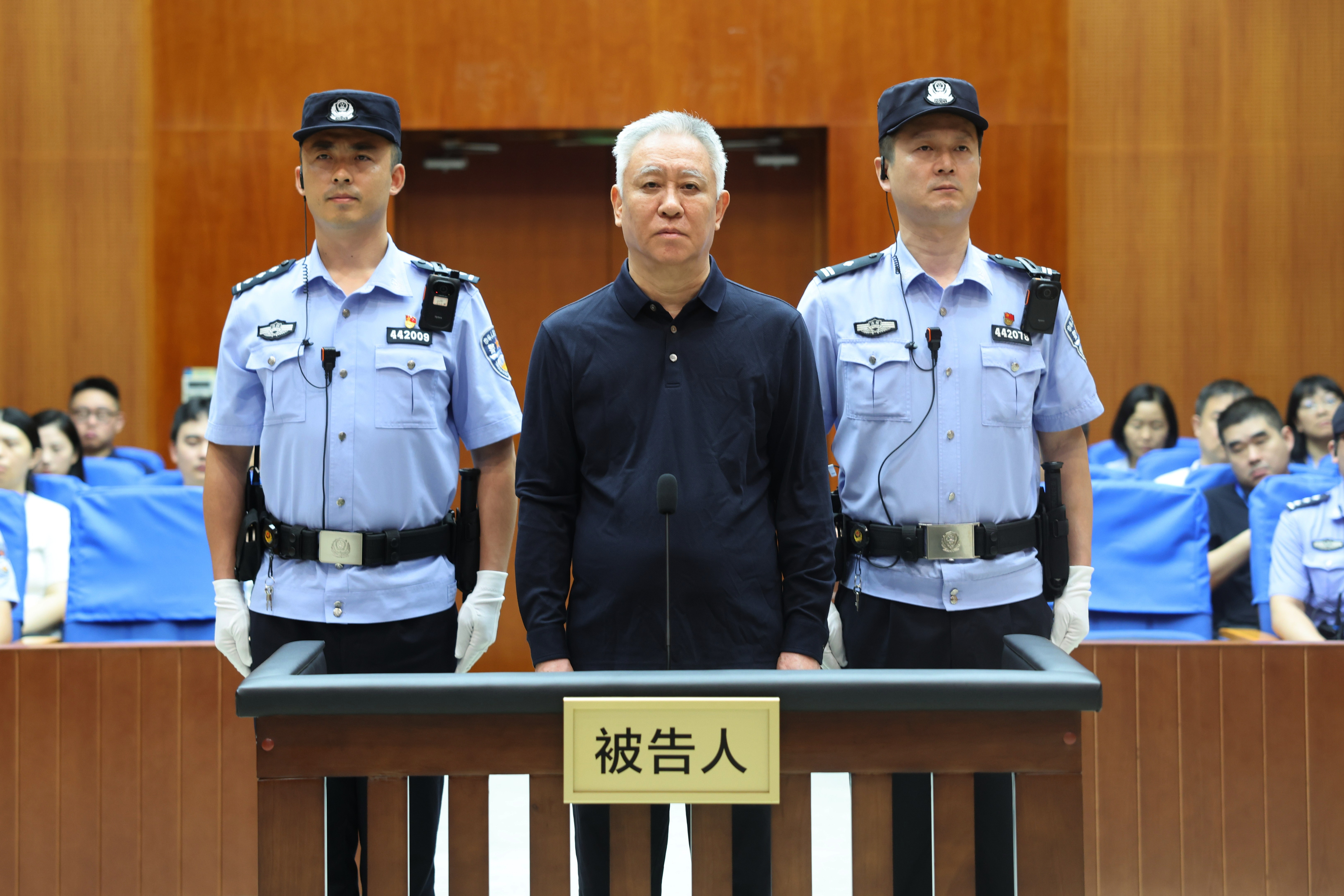 Evergrande founder Xu Jiayin (C) during a trial.