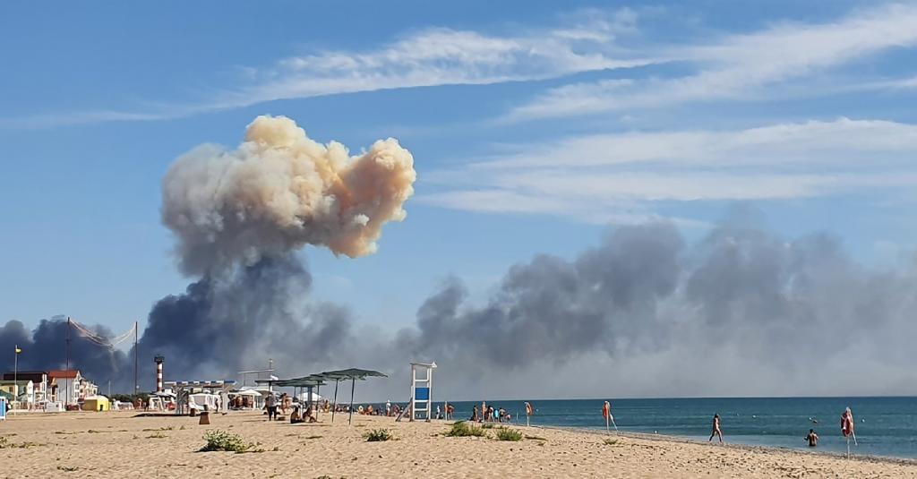Rising smoke can be seen from the beach at Saky.