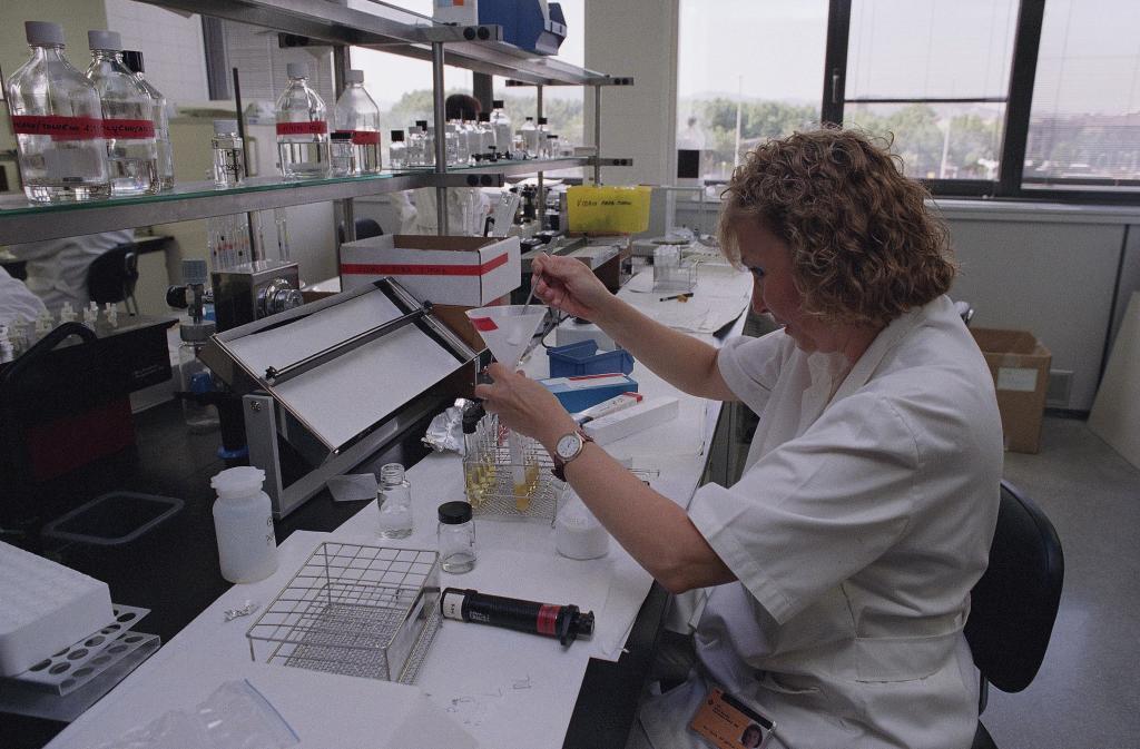 An unidentified technician works in the Olympic Games doping control laboratory
