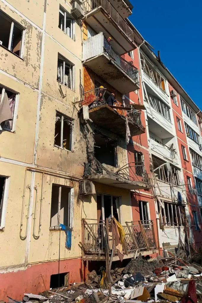 A view of the damaged apartment building after a Ukrainian drone attack